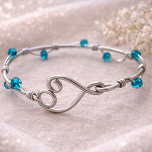 bracciale cuore fluido – perle azzurre
